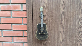 Forged iron door handle exactly repeating the shape of the guitar, beautiful golden bronze color, will look great on the door of the music studio, or will be a great gift for a musician