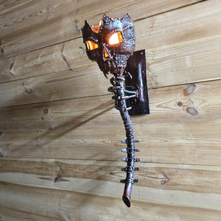 Hand-forged skeleton torch wall light in gothic style