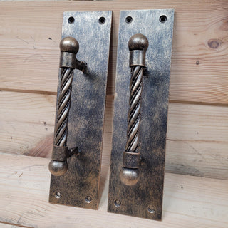 Handcrafted vintage iron door handles with antique brass finish, perfect for entry doors and gates.