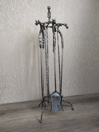Fireplace tools. Set from forged fire poker, fireplace tongs, shovel, broom, hand forged