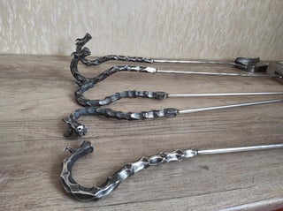 Fireplace tools. Set from forged fire poker, fireplace tongs, shovel, broom, hand forged