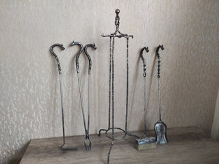 Fireplace tools. Set from forged fire poker, fireplace tongs, shovel, broom, hand forged
