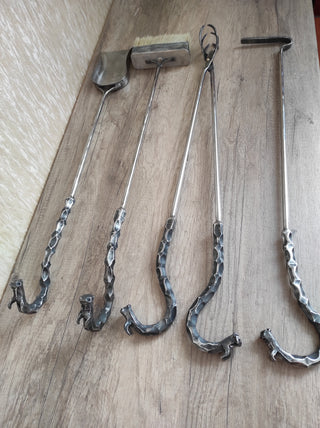 Fireplace tools. Set from forged fire poker, fireplace tongs, shovel, broom, hand forged