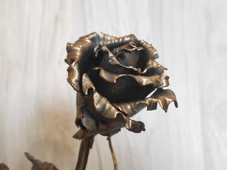 Metal rose, iron rose. Steel rose, iron rose on a stand