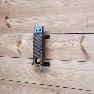 wrought iron door handle, designed to look like a USB flash drive
