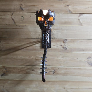 Creepy wall light resembling a demonic skull