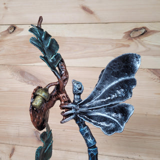 Artistic dragonfly handle on oak branch, hand-forged