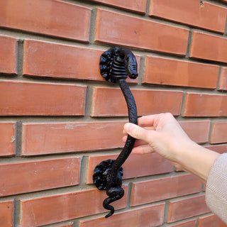 Medieval-inspired wrought iron snake handle