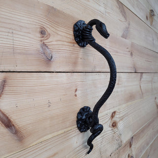 Nature-inspired iron handle with serpent head and scales