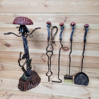Full set of 5 whimsical fireplace tools displayed, each with toadstool handles.