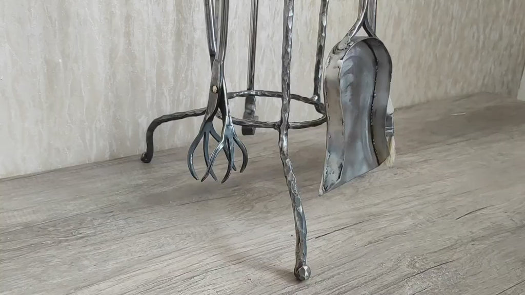 Fireplace tools. Set from forged fire poker, fireplace tongs, shovel, broom, hand forged