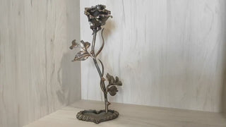 Metal rose, iron rose. Steel rose, iron rose on a stand