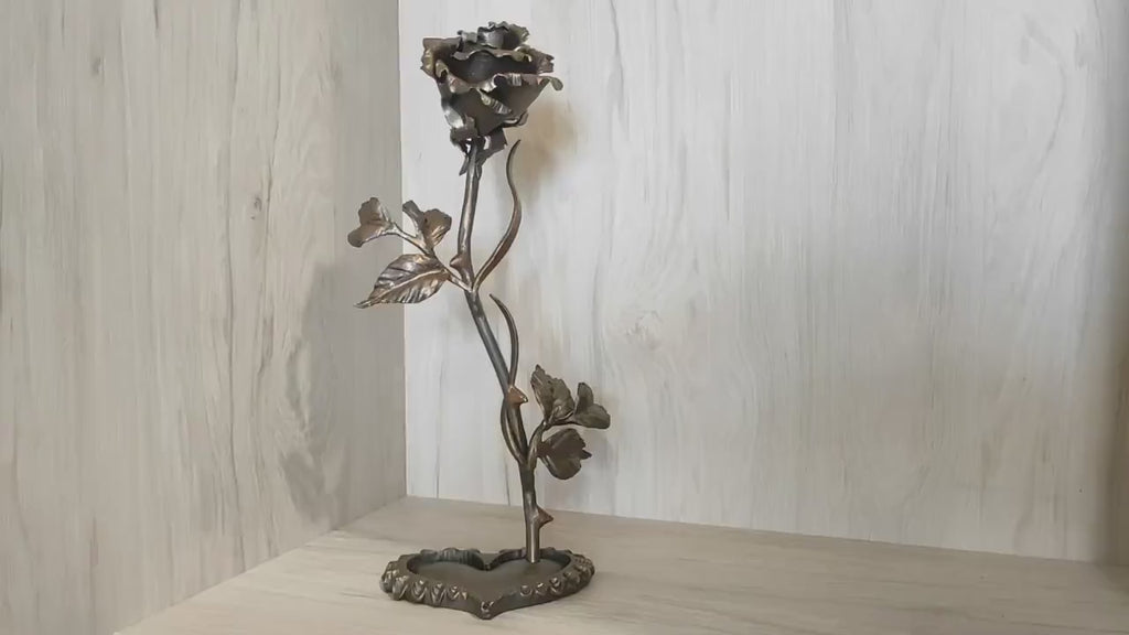 Metal rose, iron rose. Steel rose, iron rose on a stand