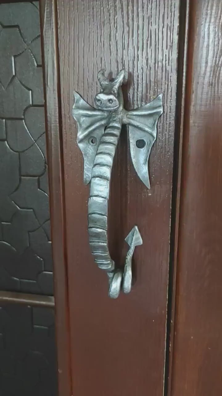 Dragon door handle in antique, medieval style